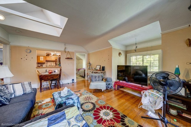 1611 W 9th Ave, Spokane, WA 99223 - living area with lofted ceiling, wood finished floors, and a skylight