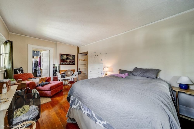 1611 W 9th Ave, Spokane, WA 99223 - bedroom with ornamental molding, wood finished floors, a walk in closet, and a closet