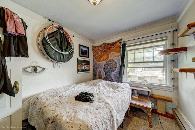 1621 W 9th Ave, Spokane, WA 99223 - bedroom featuring a baseboard heating unit, carpet flooring, and baseboards