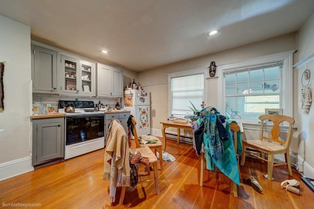 1621 W 9th Ave, Spokane, WA 99223 - kitchen with electric range oven, freestanding refrigerator, gray cabinets, light wood finished floors, and recessed lighting