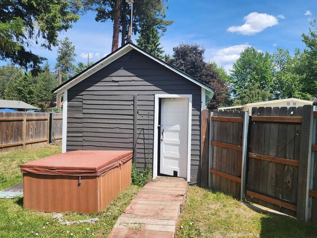 424 W Larch St, Newport, WA 99156 - view of outbuilding featuring a hot tub and a fenced backyard