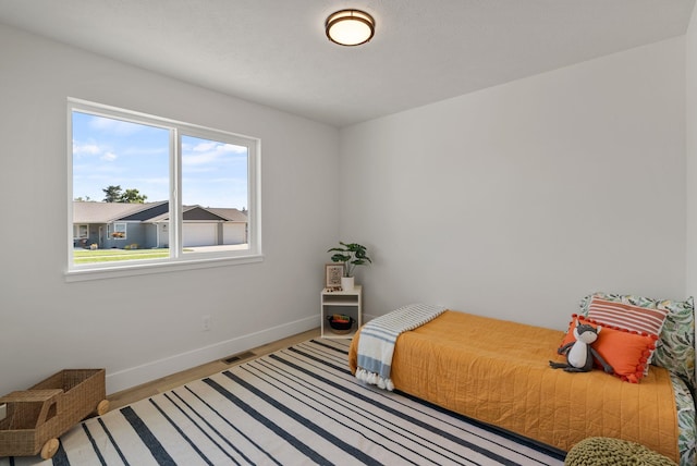 14101 E Sanson Ave, Spokane Valley, WA 99216 - bedroom featuring baseboards and wood finished floors