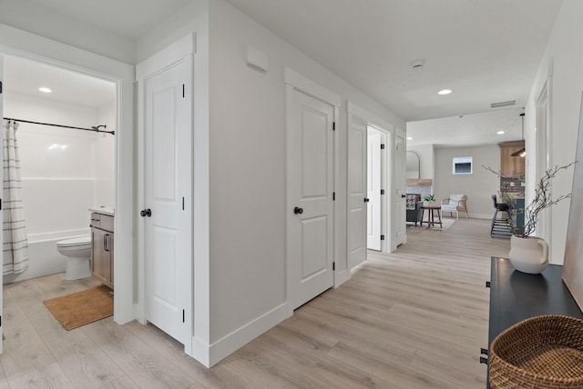 14101 E Sanson Ave, Spokane Valley, WA 99216 - hallway featuring light wood finished floors, baseboards, and recessed lighting