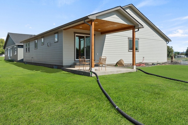 14101 E Sanson Ave, Spokane Valley, WA 99216 - rear view of house with a patio area, crawl space, and a yard