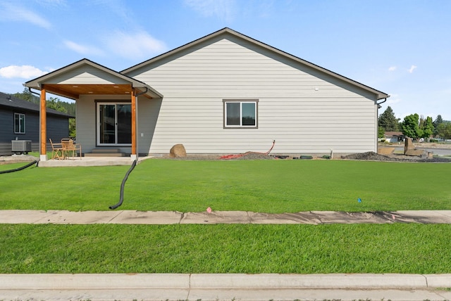 14101 E Sanson Ave, Spokane Valley, WA 99216 - back of house with central AC unit, a yard, and a patio area