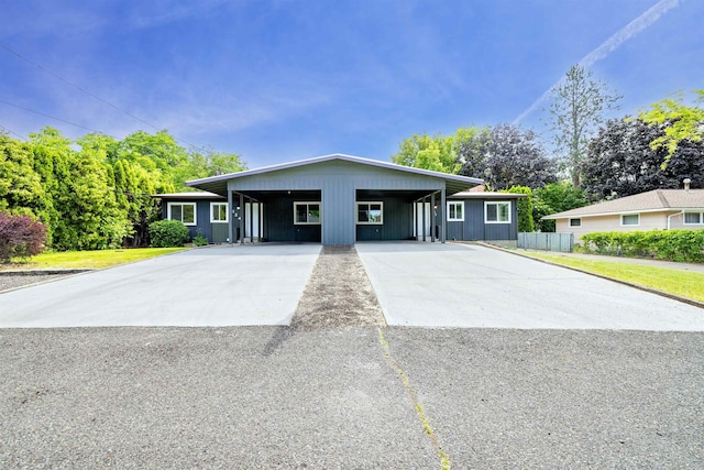 624 N Herald Rd Unit 2, Spokane Valley, WA 99206 - view of front of home with concrete driveway, an attached carport, and board and batten siding