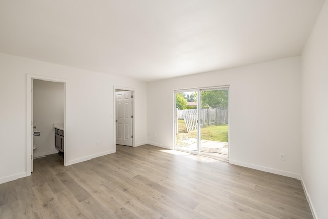 624 N Herald Rd Unit 2, Spokane Valley, WA 99206 - unfurnished bedroom with access to outside, light wood-style floors, and baseboards