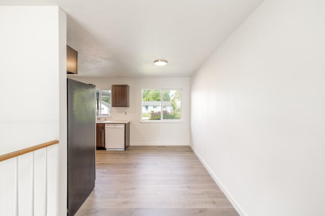 624 N Herald Rd Unit 2, Spokane Valley, WA 99206 - kitchen featuring freestanding refrigerator, dishwasher, light wood finished floors, light countertops, and baseboards