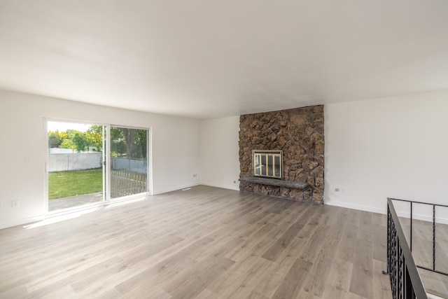624 N Herald Rd Unit 2, Spokane Valley, WA 99206 - unfurnished living room with wood finished floors, baseboards, and a fireplace