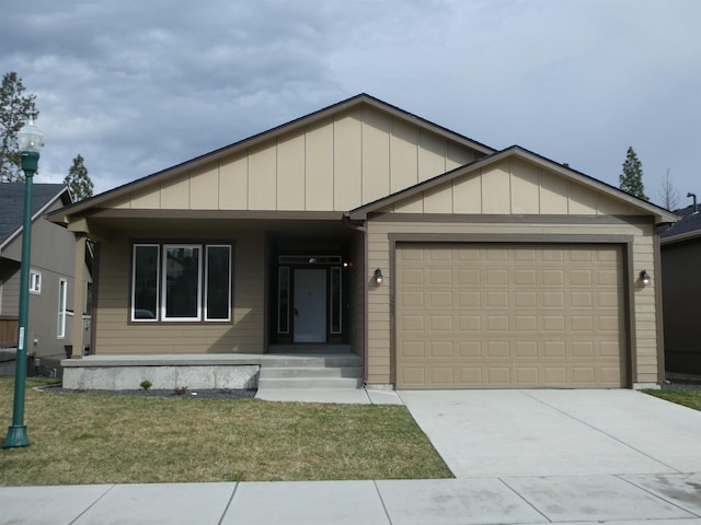3223 S Custer Ln, Spokane, WA 99223 - view of front of home with an attached garage, driveway, a porch, a front lawn, and board and batten siding