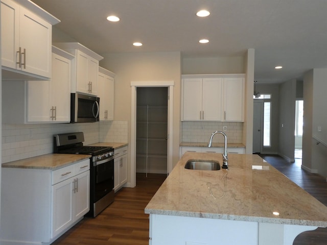 3223 S Custer Ln, Spokane, WA 99223 - kitchen featuring appliances with stainless steel finishes, a sink, dark wood finished floors, white cabinetry, and recessed lighting