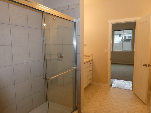 3223 S Custer Ln, Spokane, WA 99223 - full bath featuring a stall shower, vanity, and baseboards