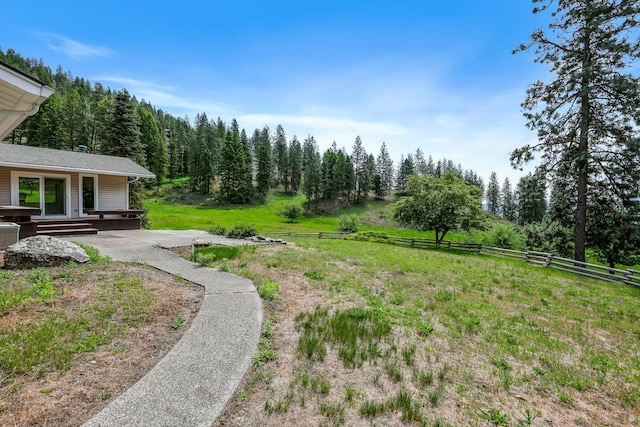 128C Buena Vista Rd, Colville, WA 99114 - view of yard featuring a view of trees and a porch