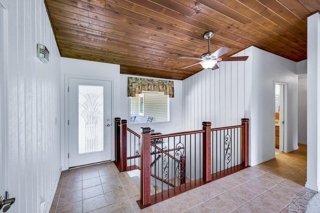 128C Buena Vista Rd, Colville, WA 99114 - entryway featuring light tile patterned floors, wood ceiling, ceiling fan, vaulted ceiling, and baseboards