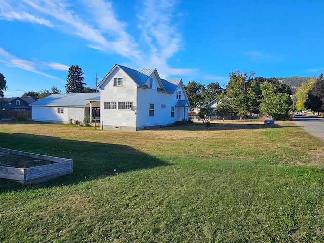 444 S Walnut St, Colville, WA 99114 - view of property exterior featuring a lawn, crawl space, and metal roof