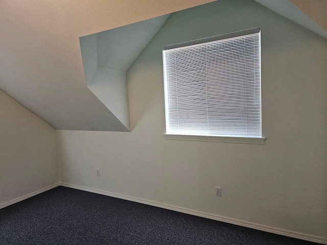 444 S Walnut St, Colville, WA 99114 - bonus room with lofted ceiling, dark carpet, and baseboards