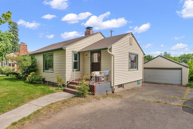 2503 W Upton Ave, Spokane, WA 99205 - view of front of home with a porch, a chimney, an outdoor structure, a front yard, and a detached garage