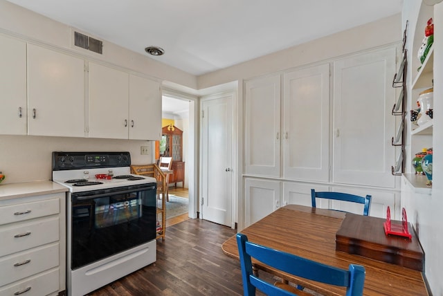 2503 W Upton Ave, Spokane, WA 99205 - kitchen featuring electric range, white cabinetry, dark wood-style flooring, and light countertops
