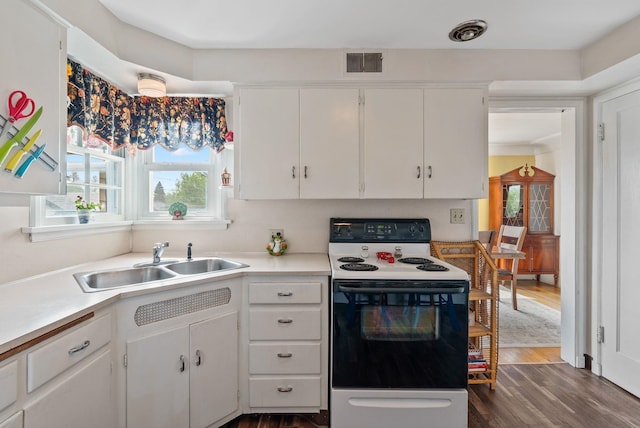 2503 W Upton Ave, Spokane, WA 99205 - kitchen featuring range with electric cooktop, a sink, light countertops, and white cabinetry
