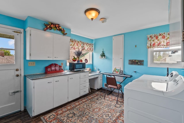 2503 W Upton Ave, Spokane, WA 99205 - kitchen featuring washing machine and clothes dryer, dark wood-style flooring, plenty of natural light, and white cabinets