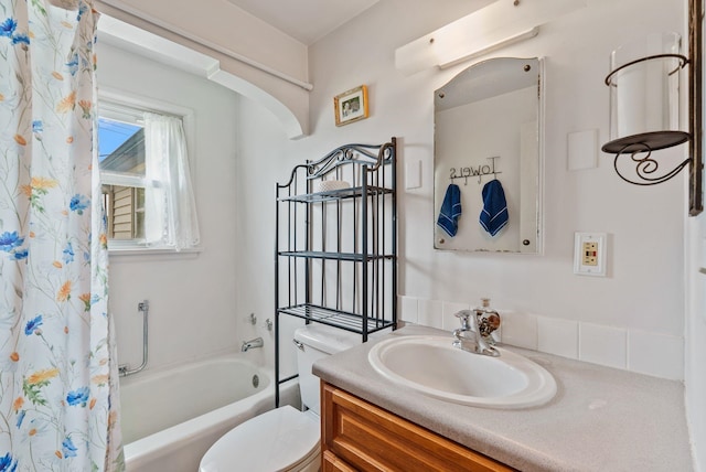 2503 W Upton Ave, Spokane, WA 99205 - bathroom featuring toilet, vanity, and shower / bathtub combination with curtain