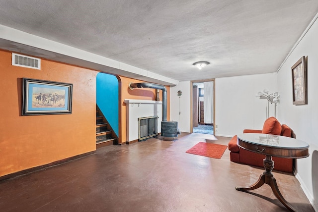 2503 W Upton Ave, Spokane, WA 99205 - living room featuring baseboards, stairway, concrete floors, and arched walkways