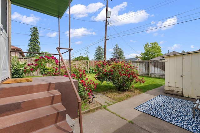 2503 W Upton Ave, Spokane, WA 99205 - fenced backyard featuring a patio and an outbuilding