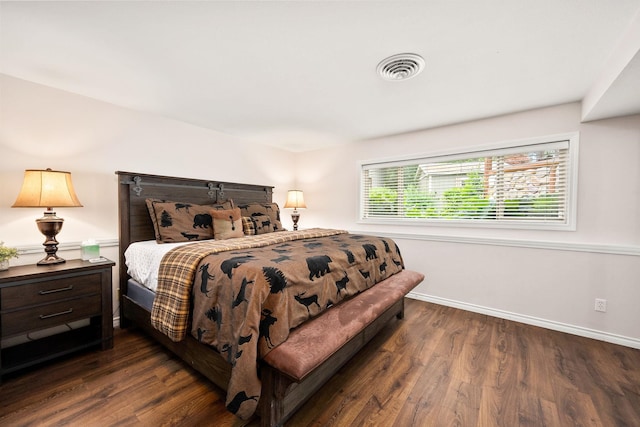 10101 N Pines Rd, Hayden, ID 83835 - bedroom with dark wood-type flooring and baseboards