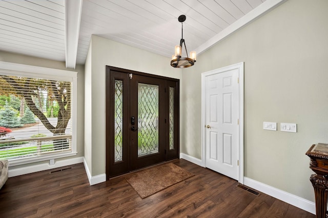 10101 N Pines Rd, Hayden, ID 83835 - entryway with a chandelier, baseboards, dark wood-type flooring, and wood ceiling