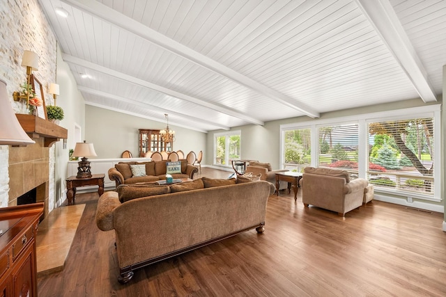 10101 N Pines Rd, Hayden, ID 83835 - living room featuring wood finished floors, a large fireplace, and a chandelier