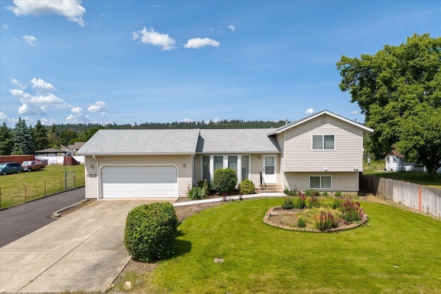 13715 E Rich Ave, Spokane Valley, WA 99216 - tri-level home featuring driveway, an attached garage, and roof with shingles