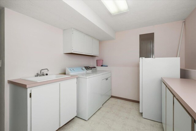 13715 E Rich Ave, Spokane Valley, WA 99216 - laundry room featuring washing machine and clothes dryer, cabinet space, and light floors