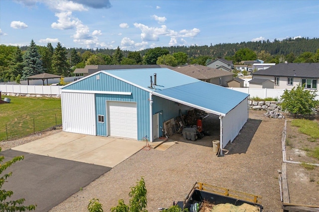 13715 E Rich Ave, Spokane Valley, WA 99216 - garage with driveway, a forest view, and a detached garage