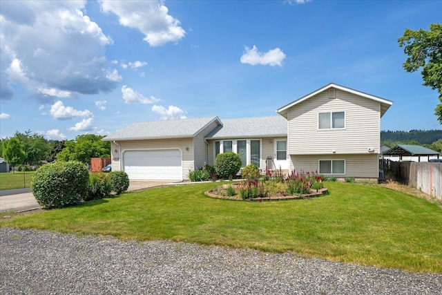 13715 E Rich Ave, Spokane Valley, WA 99216 - tri-level home featuring an attached garage and driveway