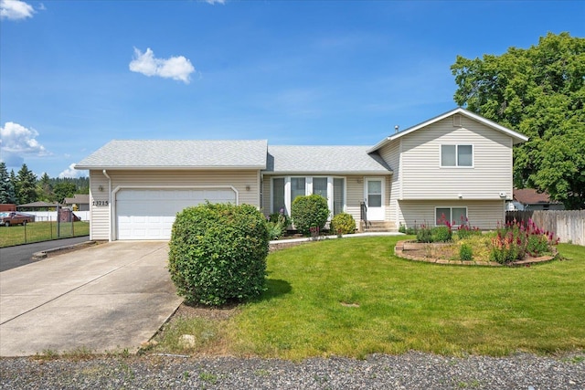 13715 E Rich Ave, Spokane Valley, WA 99216 - split level home with a garage, concrete driveway, and a shingled roof