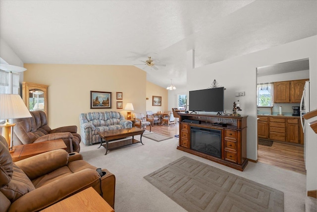 13715 E Rich Ave, Spokane Valley, WA 99216 - living room featuring light carpet, plenty of natural light, vaulted ceiling, ceiling fan, and a chandelier