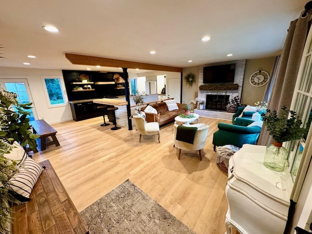8616 E Desmet Ave, Spokane Valley, WA 99212 - living area with light wood finished floors, a brick fireplace, and recessed lighting