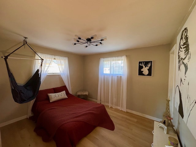 8616 E Desmet Ave, Spokane Valley, WA 99212 - bedroom featuring light wood-type flooring and baseboards