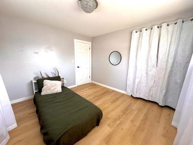 8616 E Desmet Ave, Spokane Valley, WA 99212 - bedroom featuring light wood-style flooring and baseboards