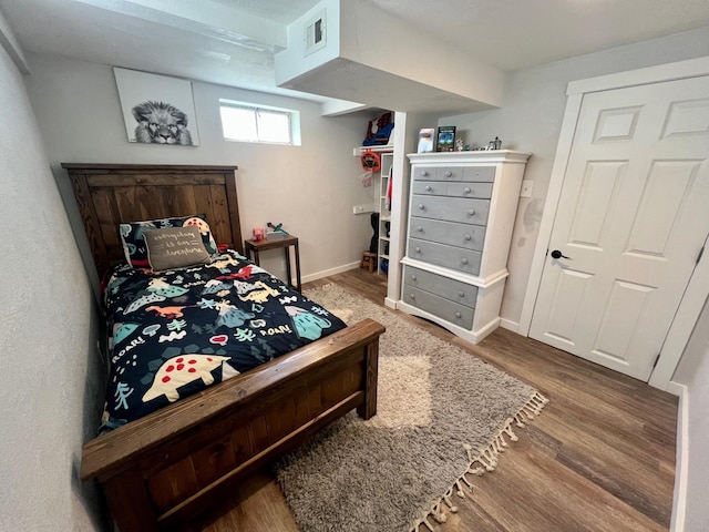 8616 E Desmet Ave, Spokane Valley, WA 99212 - bedroom featuring wood finished floors and baseboards