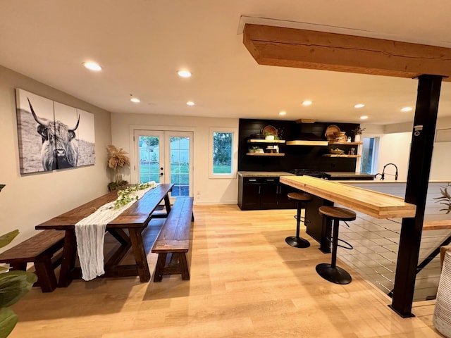 8616 E Desmet Ave, Spokane Valley, WA 99212 - dining space featuring recessed lighting, light wood-type flooring, bar with sink, and french doors