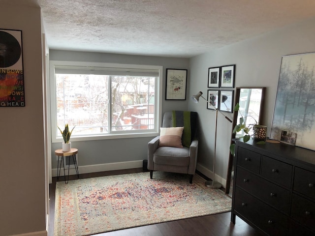1617 S Bernard St, Spokane, WA 99203 - sitting room featuring baseboards, a textured ceiling, and wood finished floors