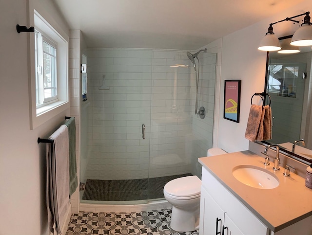 1617 S Bernard St, Spokane, WA 99203 - bathroom with a shower stall, vanity, tile patterned flooring, and toilet