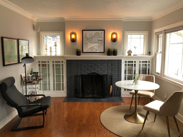 1617 S Bernard St, Spokane, WA 99203 - living area with wood finished floors, a fireplace, crown molding, and baseboards