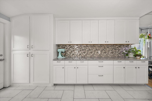 1306 W Euclid Ave, Spokane, WA 99205 - kitchen with backsplash, white cabinetry, and dark countertops