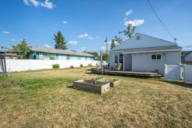 1306 W Euclid Ave, Spokane, WA 99205 - view of yard with a vegetable garden, a wooden deck, and a gate