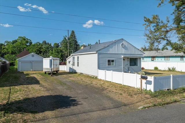 1306 W Euclid Ave, Spokane, WA 99205 - view of home's exterior featuring a garage and an outbuilding