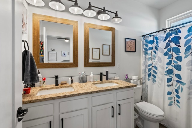 1812 E Columbia Ave, Spokane, WA 99208 - bathroom with double vanity, toilet, and a shower with curtain