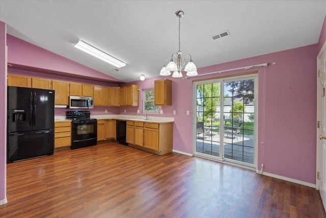 12512 W 10th Ave, Airway Heights, WA 99001 - kitchen with black appliances, vaulted ceiling, a chandelier, light countertops, and dark wood finished floors