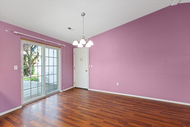 12512 W 10th Ave, Airway Heights, WA 99001 - unfurnished room featuring a chandelier, wood finished floors, baseboards, and vaulted ceiling